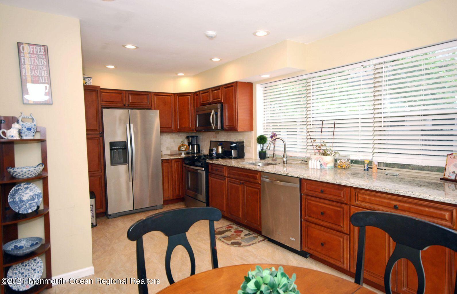 32 Waverly Lane Jackson, NJ 08527 - Photo 7 of 19 a kitchen with stainless steel appliances granite countertop a refrigerator and a sink