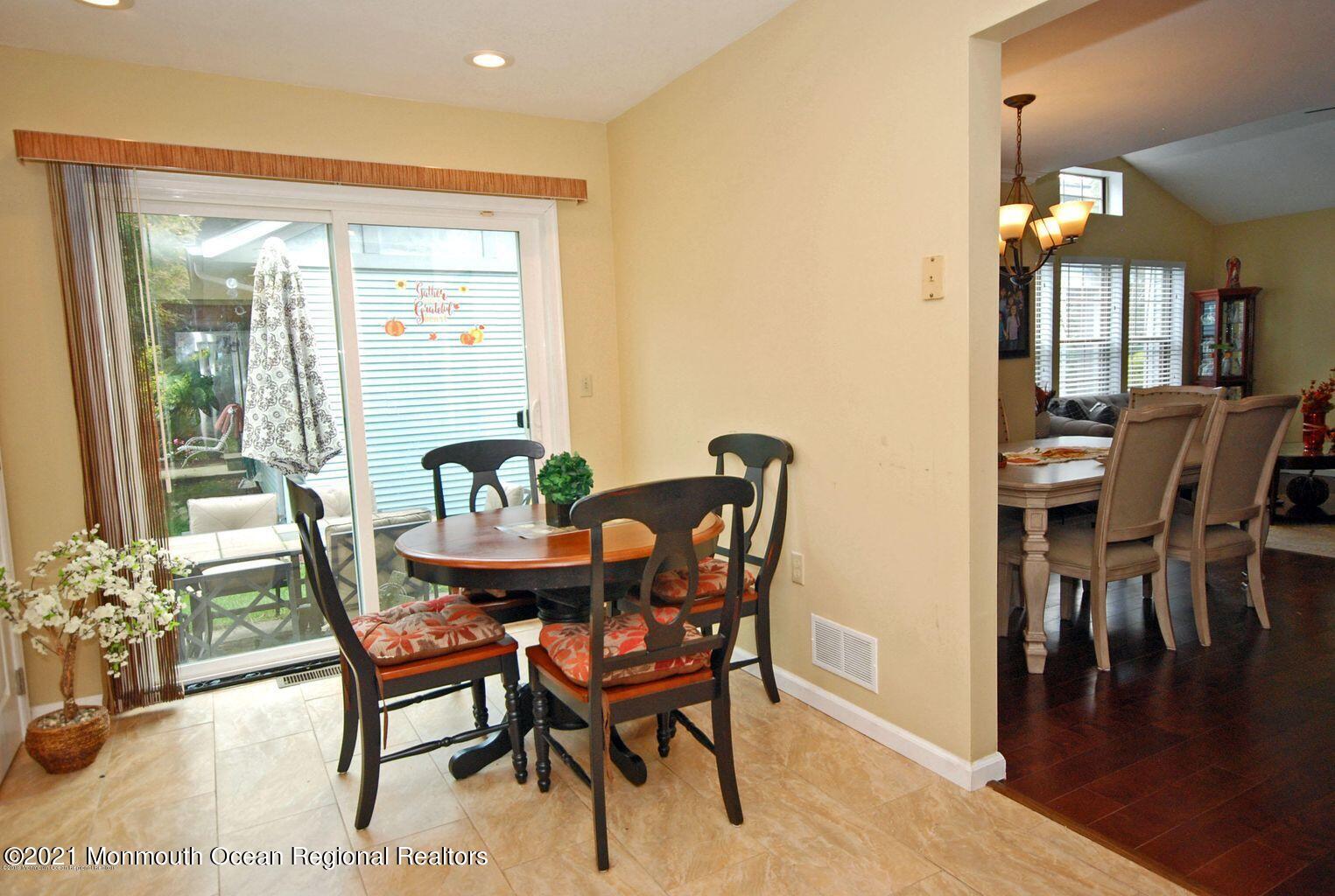 32 Waverly Lane Jackson, NJ 08527 - Photo 9 of 19 a view of a dining room with furniture and wooden floor