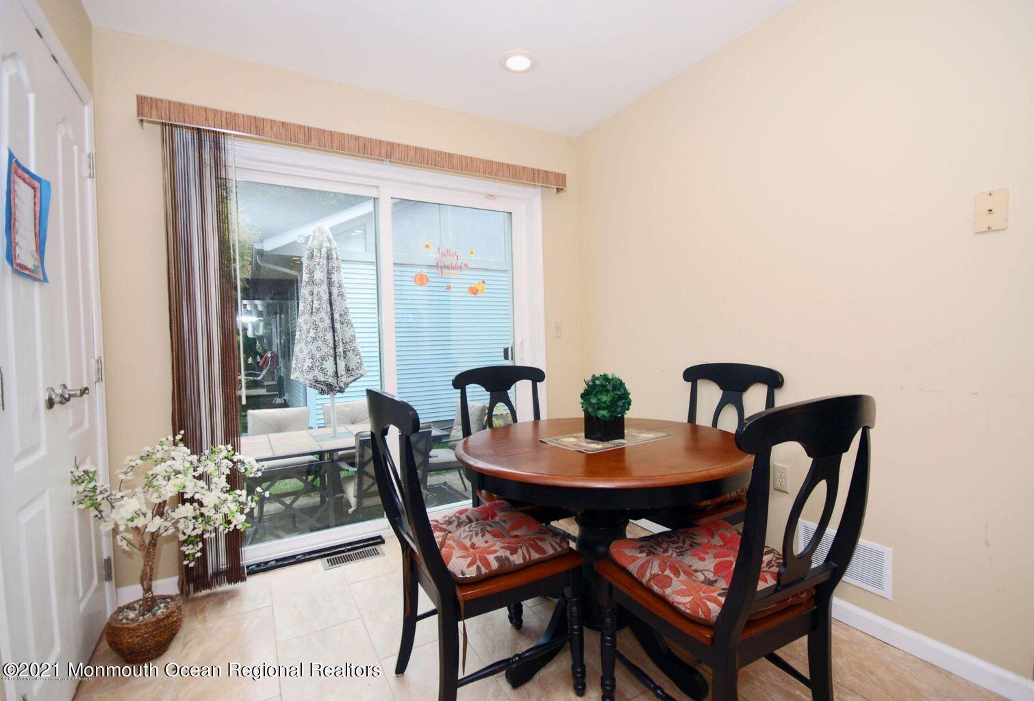 32 Waverly Lane Jackson, NJ 08527 - Photo 10 of 19 a dining room with furniture and wooden floor