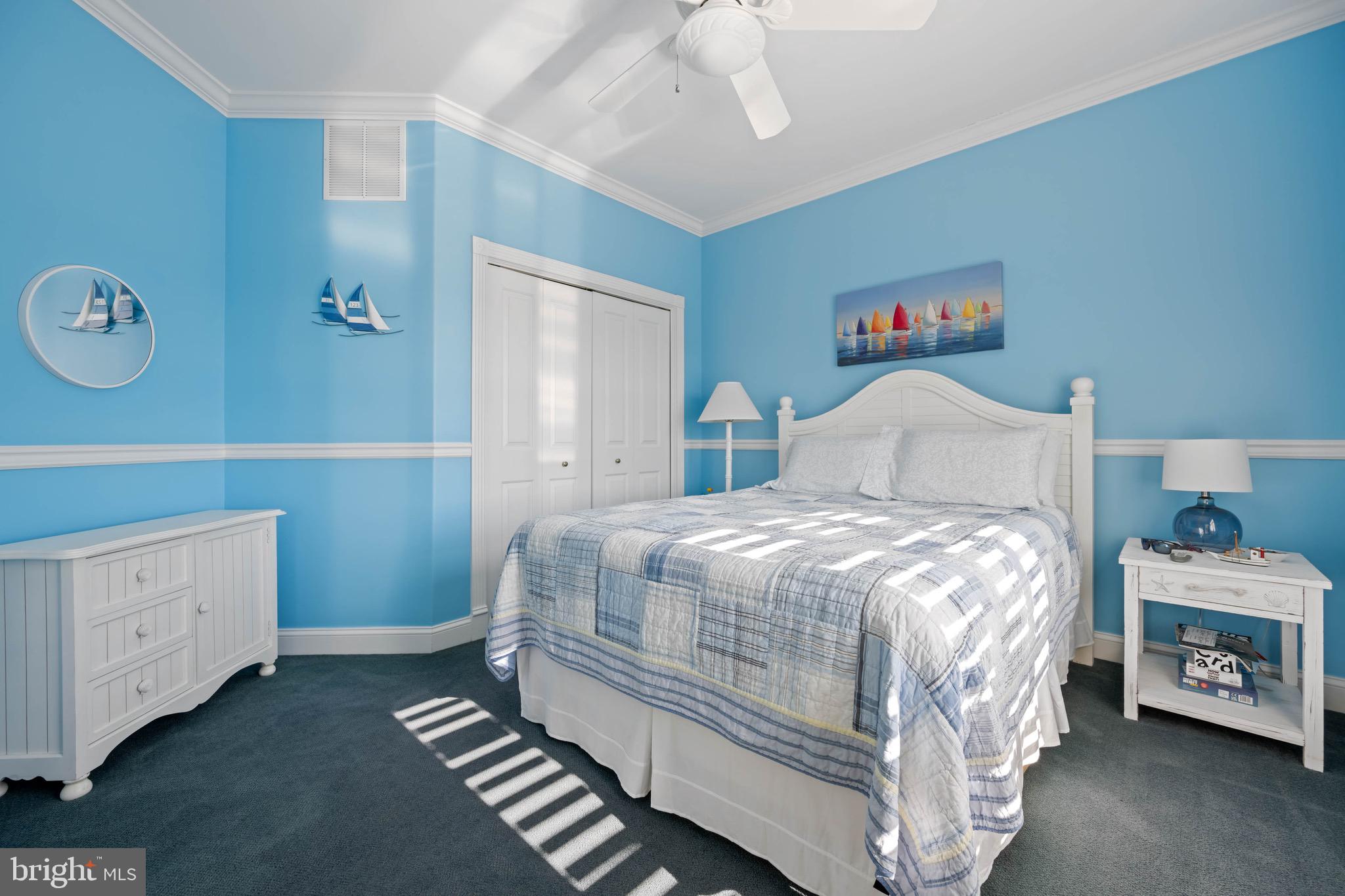 12959 Harbor Road Ocean City, MD 21842 - Photo 32 of 85 a bedroom with a bed and a window