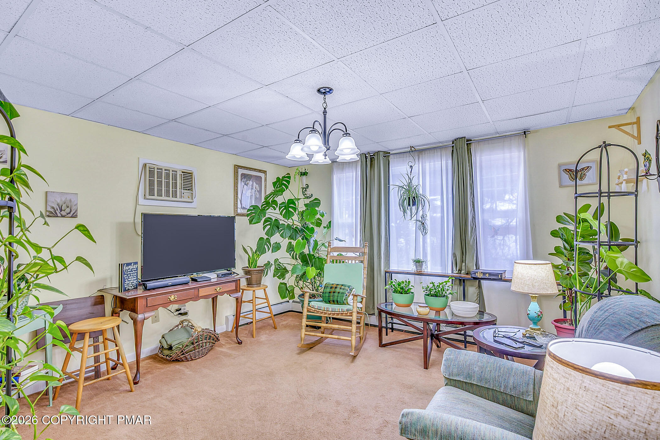 12 Coal Street Nesquehoning, PA 18240 - Photo 15 of 37 a living room with furniture and a chandelier