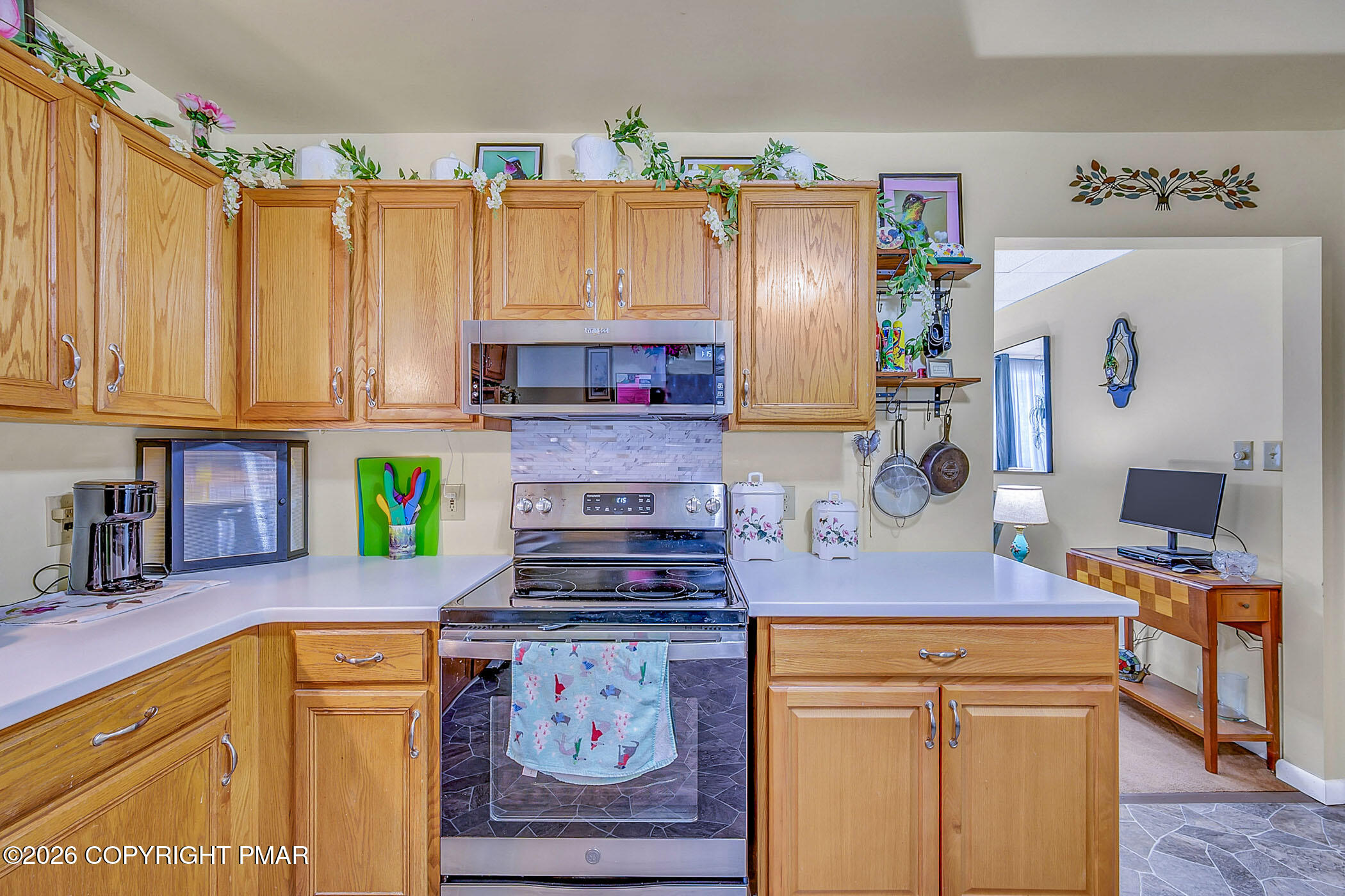 12 Coal Street Nesquehoning, PA 18240 - Photo 16 of 37 a kitchen with stainless steel appliances a stove a refrigerator a sink and a wooden cabinets