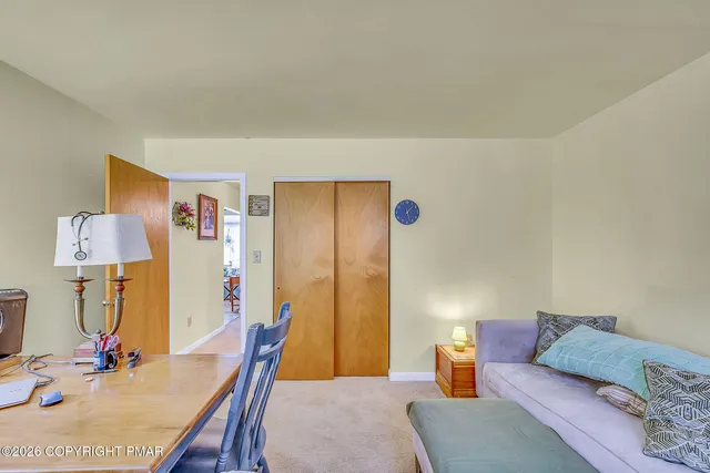 a kitchen with stainless steel appliances lots of clutter and cabinets