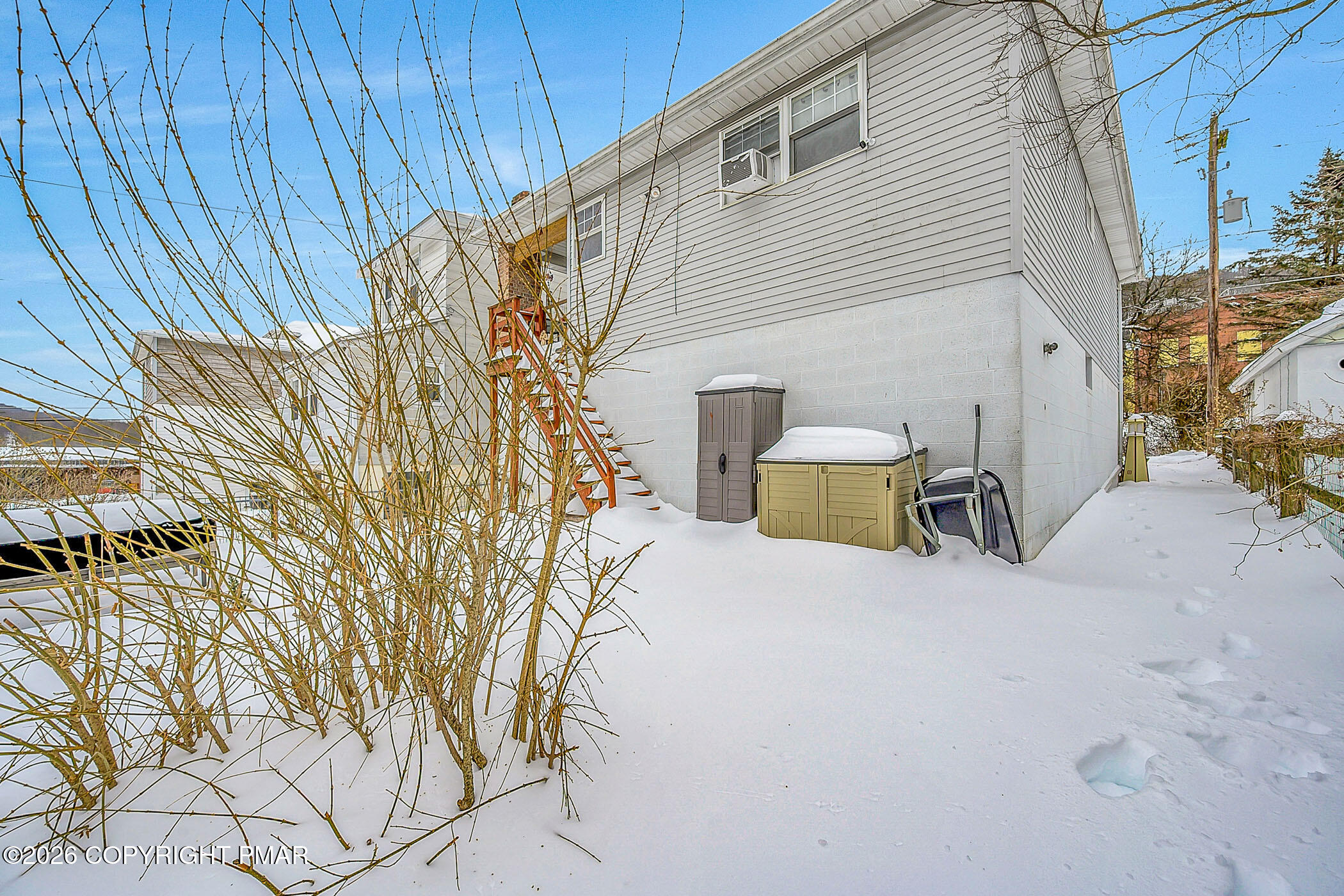 12 Coal Street Nesquehoning, PA 18240 - Photo 35 of 37 a view of a patio with table and chairs with wooden fence and plants