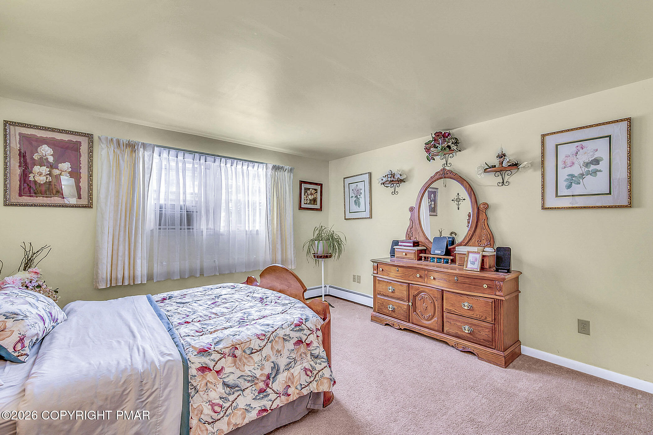 12 Coal Street Nesquehoning, PA 18240 - Photo 6 of 37 a bedroom with a bed and a chandelier