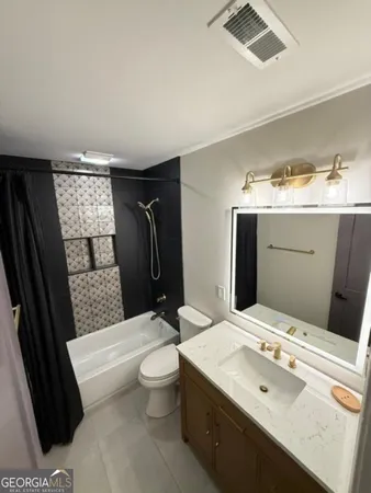 a bathroom with a shower and a sink