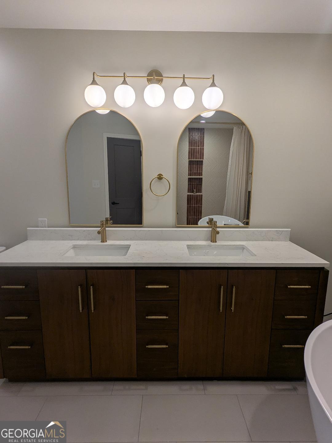 161 Hancock Road Williamson, GA 30292 - Photo 29 of 44 a bathroom with a sink and a mirror