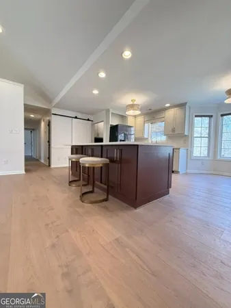 a view of kitchen with furniture and window