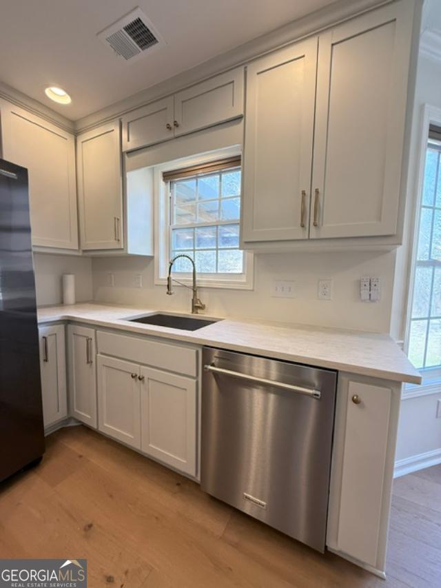 161 Hancock Road Williamson, GA 30292 - Photo 7 of 44 a kitchen with granite countertop stainless steel appliances sink and cabinets
