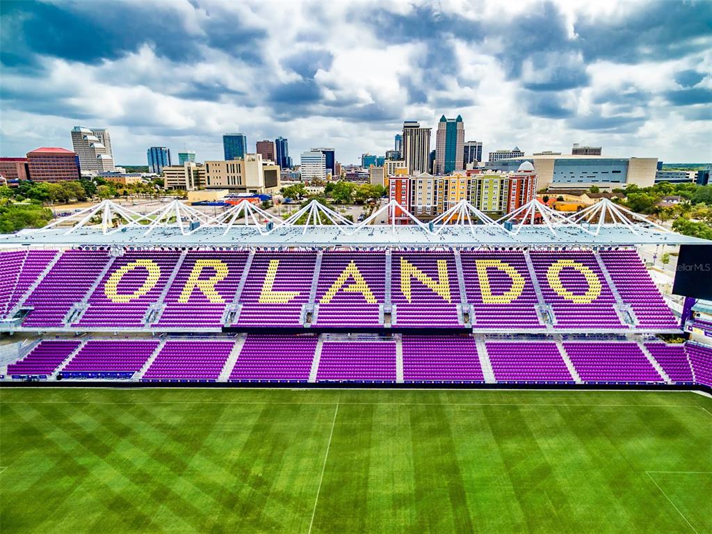 515 Daniels Avenue Orlando, FL 32801 - Photo 11 of 36 a view of swimming pool with lawn chairs and wooden fence