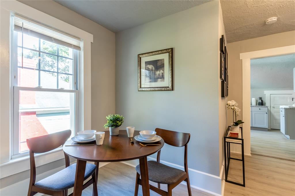 515 Daniels Avenue Orlando, FL 32801 - Photo 15 of 36 a view of a dining room with furniture window and wooden floor