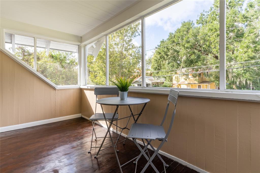 515 Daniels Avenue Orlando, FL 32801 - Photo 19 of 36 a view of a dining room with furniture window and wooden floor