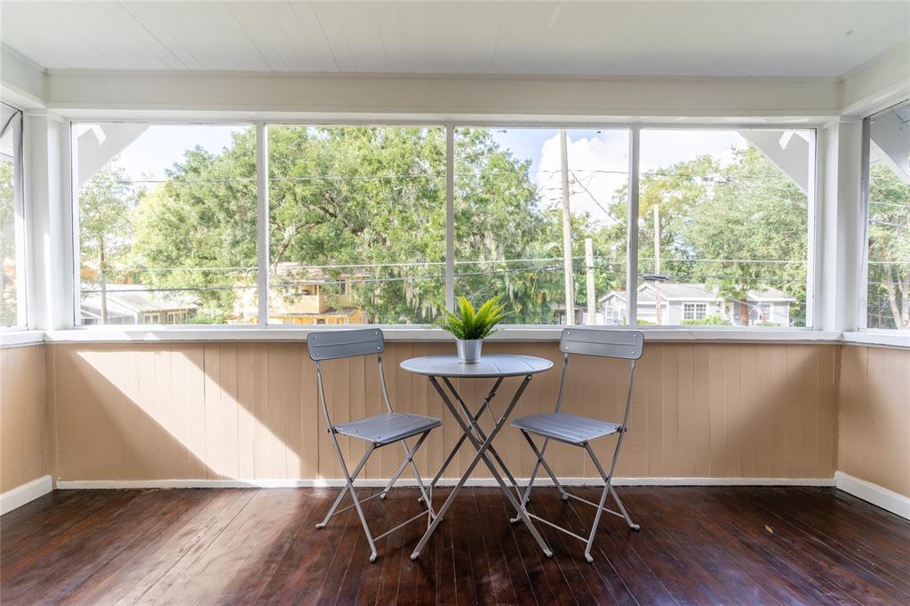 515 Daniels Avenue Orlando, FL 32801 - Photo 7 of 36 a view of a dining room with furniture and wooden floor
