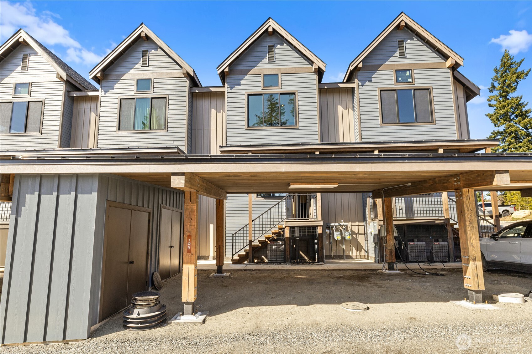105 Riverbend Loop Cle Elum, WA 98922 - Photo 18 of 22 a front view of a house with a yard and garage