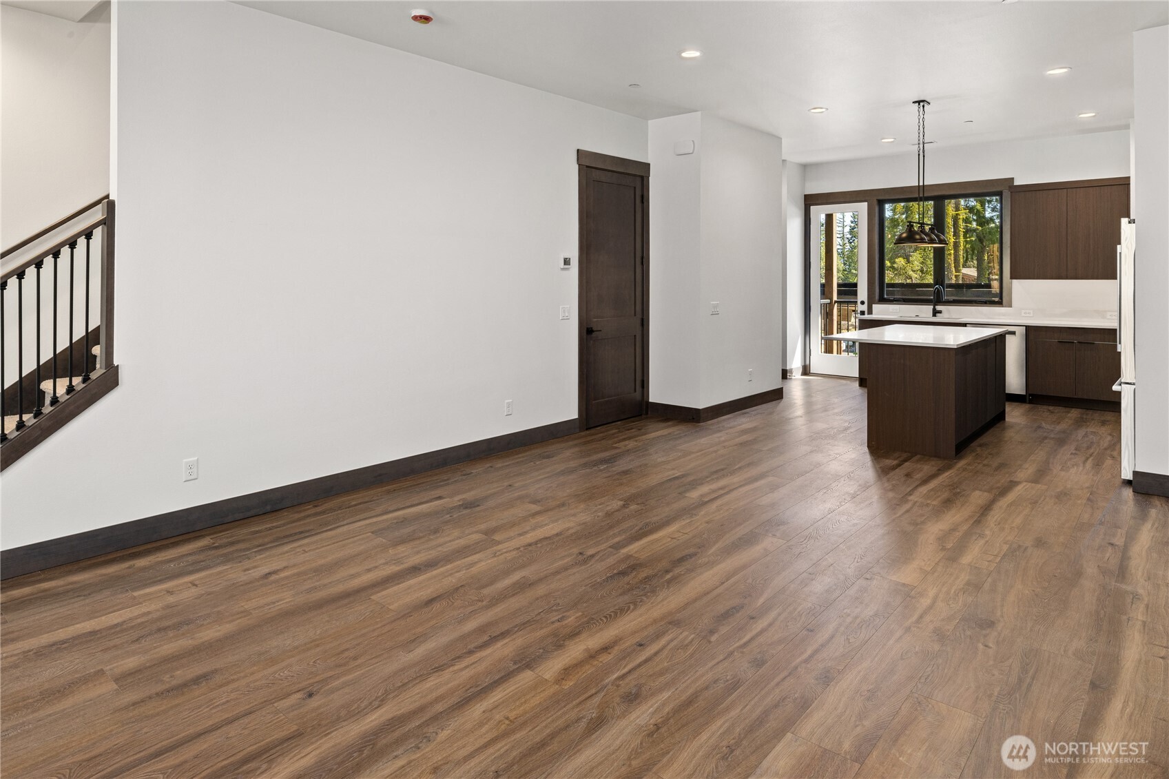 105 Riverbend Loop Cle Elum, WA 98922 - Photo 4 of 22 a large kitchen with a wooden floor and windows