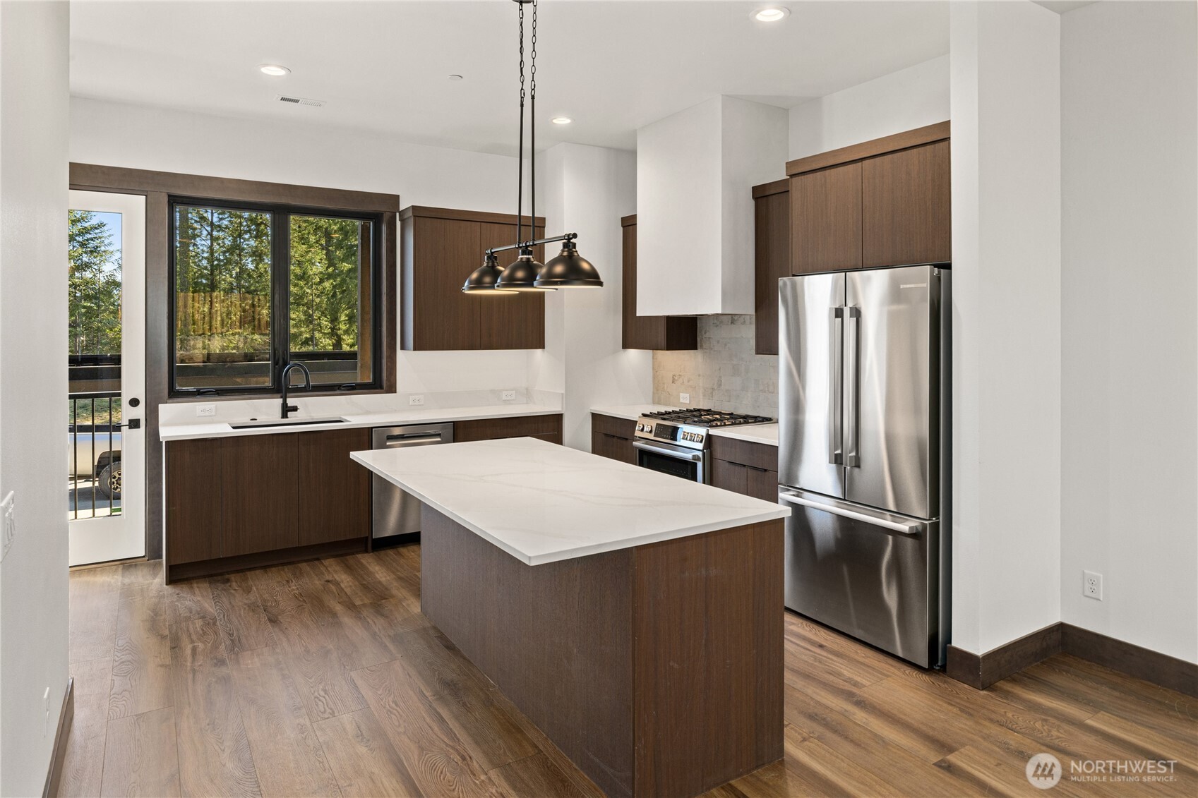 105 Riverbend Loop Cle Elum, WA 98922 - Photo 6 of 22 a large kitchen with a large window a refrigerator and a sink