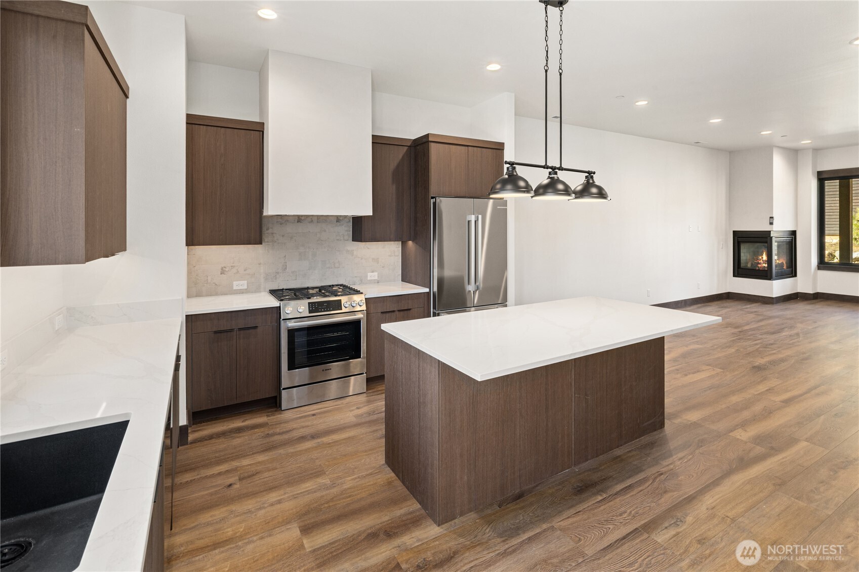 105 Riverbend Loop Cle Elum, WA 98922 - Photo 7 of 22 a kitchen with granite countertop a refrigerator and a stove top oven