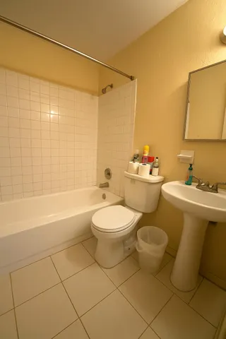 a bathroom with a toilet a sink and a bathtub