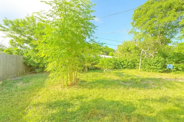 a view of yard with swimming pool