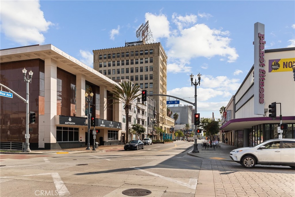 115 West 4th Street, Unit 203 Long Beach, CA 90802 - Photo 14 of 32 a front view of a building with street view