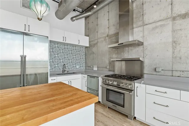 a kitchen with a stove and a refrigerator