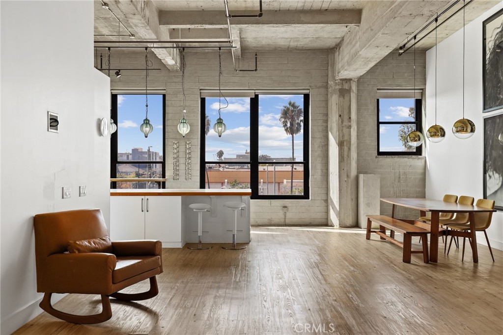 115 West 4th Street, Unit 203 Long Beach, CA 90802 - Photo 4 of 32 a living room with furniture and wooden floor