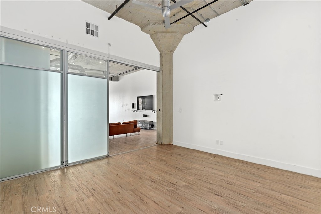115 West 4th Street, Unit 203 Long Beach, CA 90802 - Photo 6 of 32 a view of a room with wooden floor