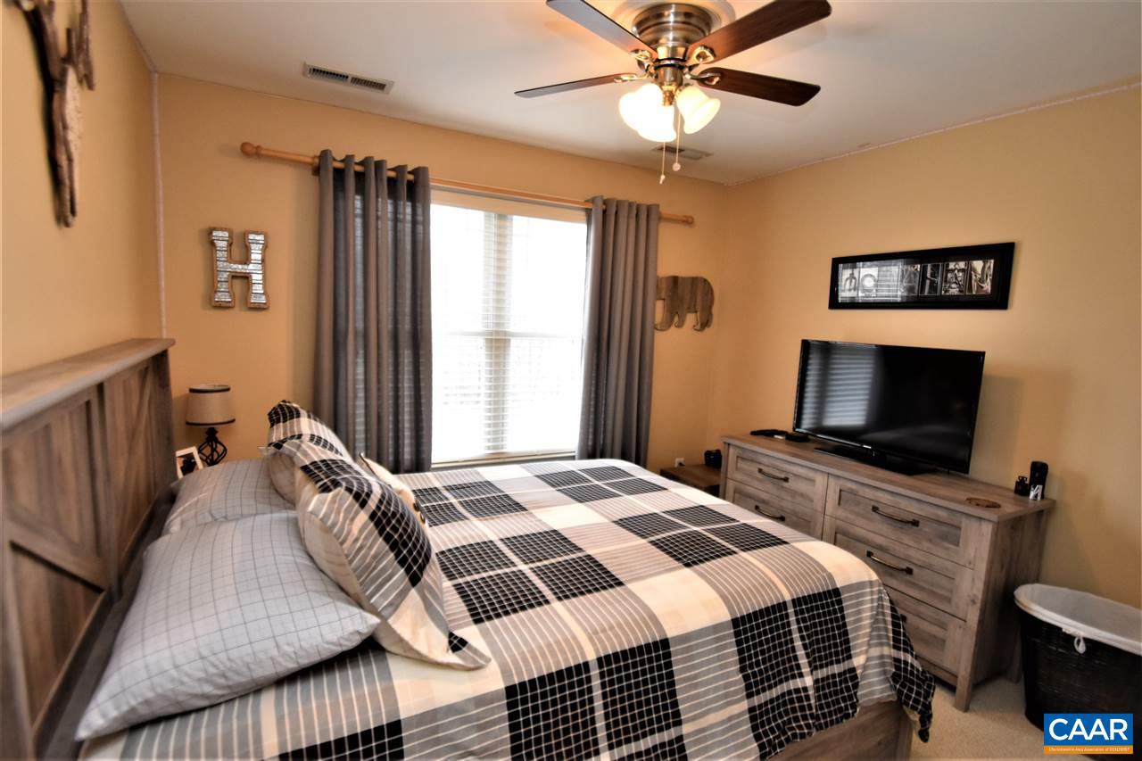 155 Pine Ridge Road Faber, VA 22938 - Photo 11 of 30 a bedroom with a bed and a flat screen tv