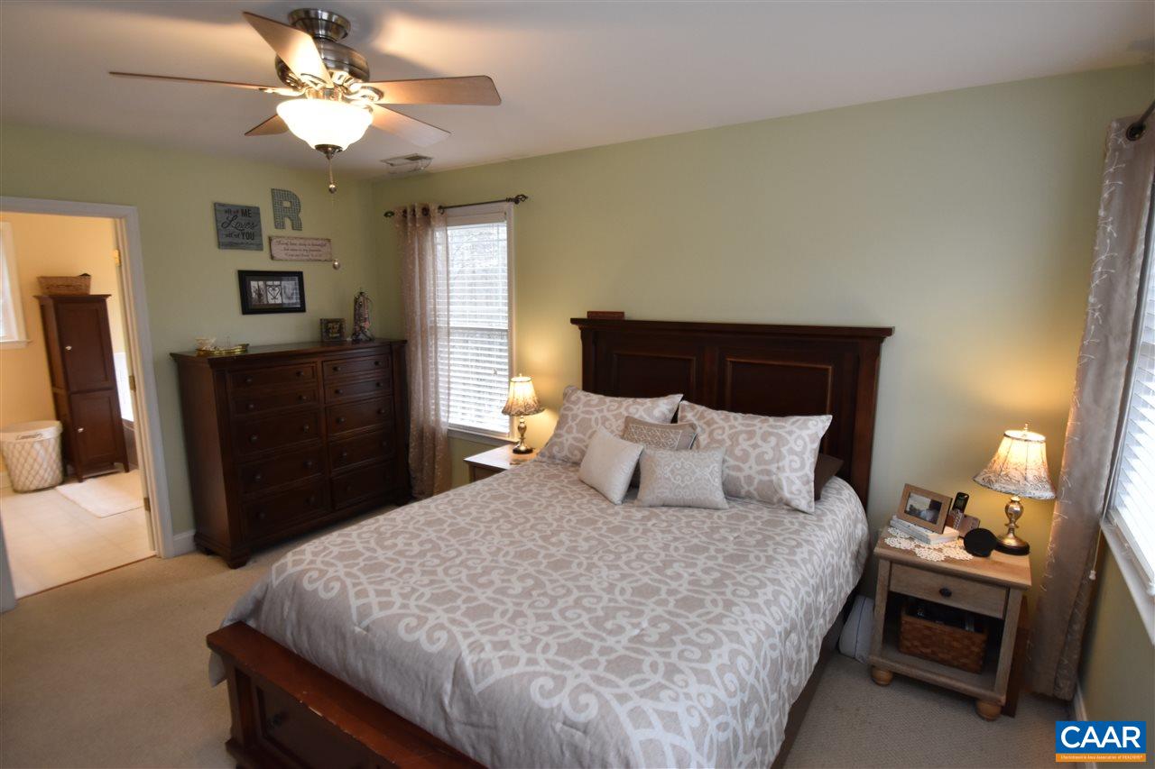 155 Pine Ridge Road Faber, VA 22938 - Photo 17 of 30 a bedroom with a bed and wooden floor