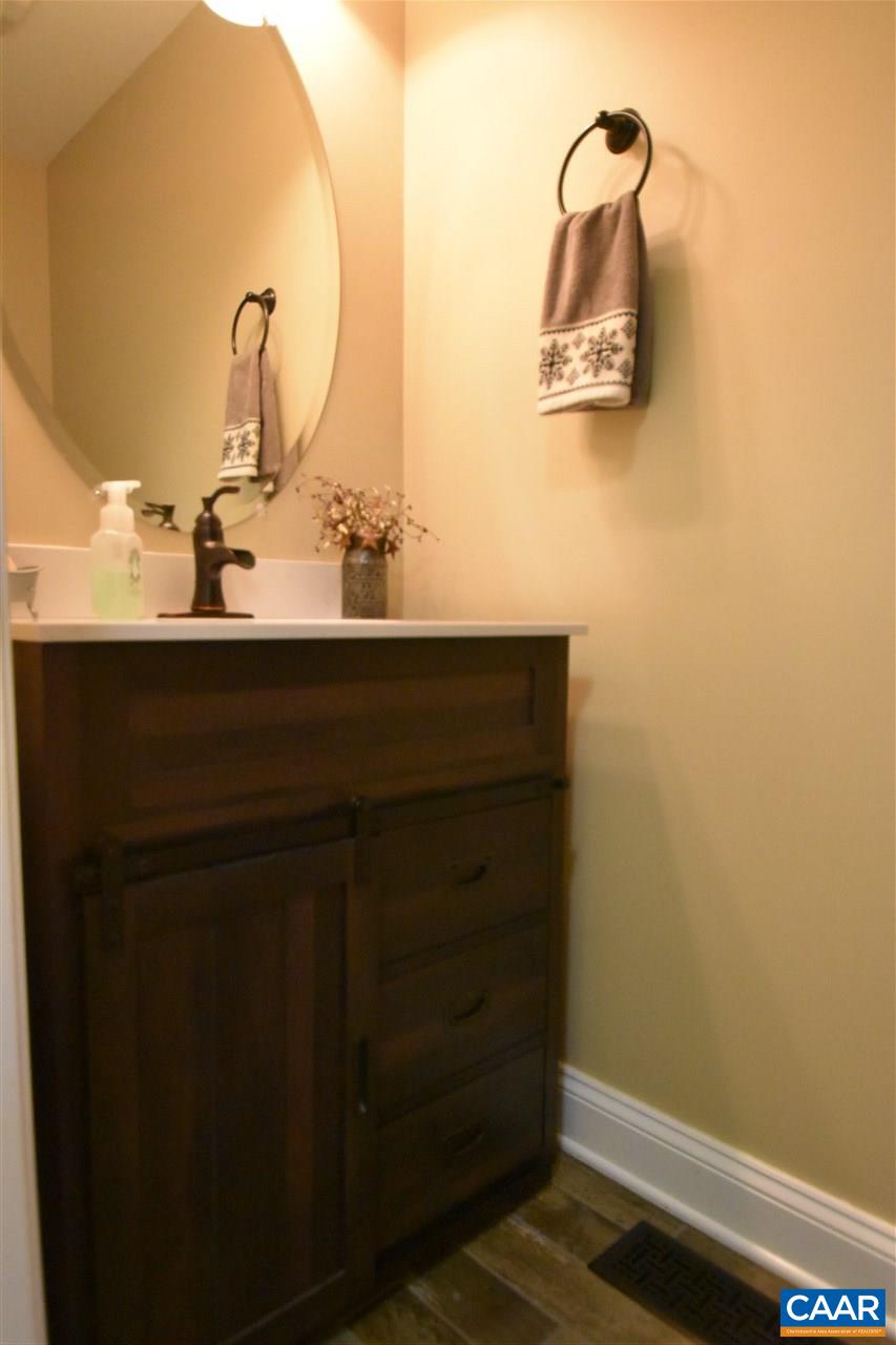 155 Pine Ridge Road Faber, VA 22938 - Photo 24 of 30 a bathroom with a sink and a mirror