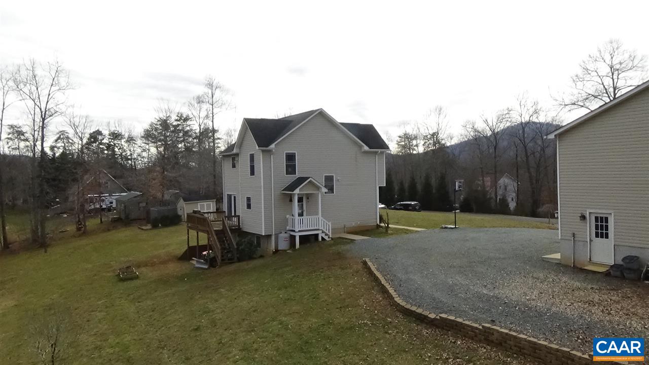 155 Pine Ridge Road Faber, VA 22938 - Photo 29 of 30 a backyard of a house with barbeque oven