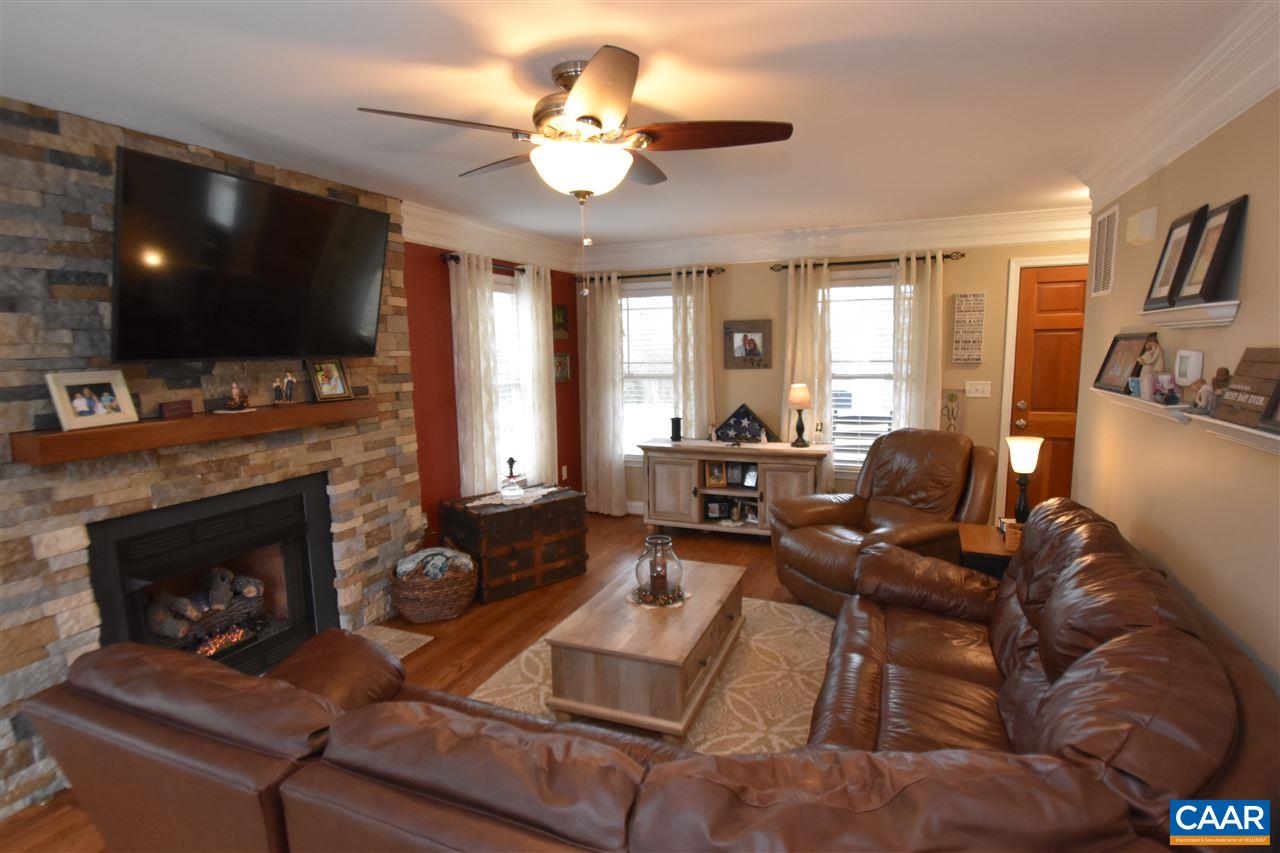155 Pine Ridge Road Faber, VA 22938 - Photo 3 of 30 a living room with furniture a flat screen tv and a fireplace