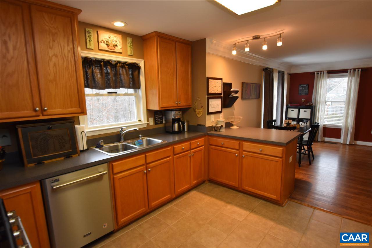 155 Pine Ridge Road Faber, VA 22938 - Photo 8 of 30 a kitchen with stainless steel appliances granite countertop a sink stove and cabinets