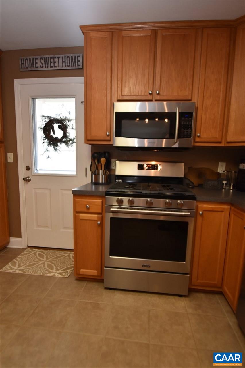 155 Pine Ridge Road Faber, VA 22938 - Photo 10 of 30 a stove top oven sitting inside of a kitchen