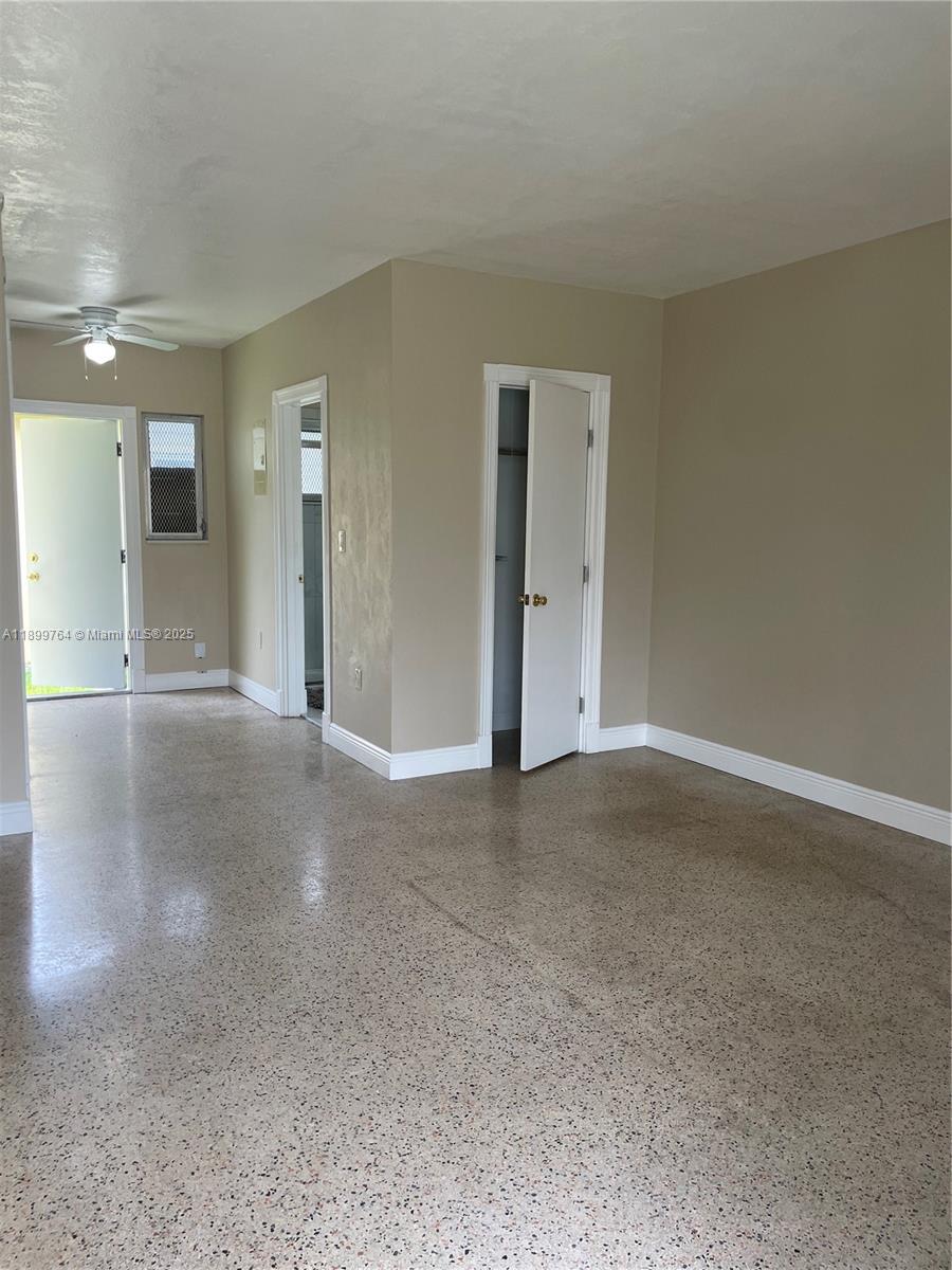 940 Southwest 4th Street, Unit 2 Miami, FL 33130 - Photo 5 of 6 a view of a big room with closet and windows