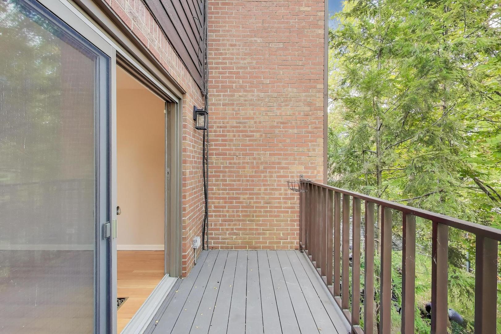 300 Boardwalk Place Park Ridge, IL 60068 - Photo 15 of 52 a view of a balcony with wooden floor