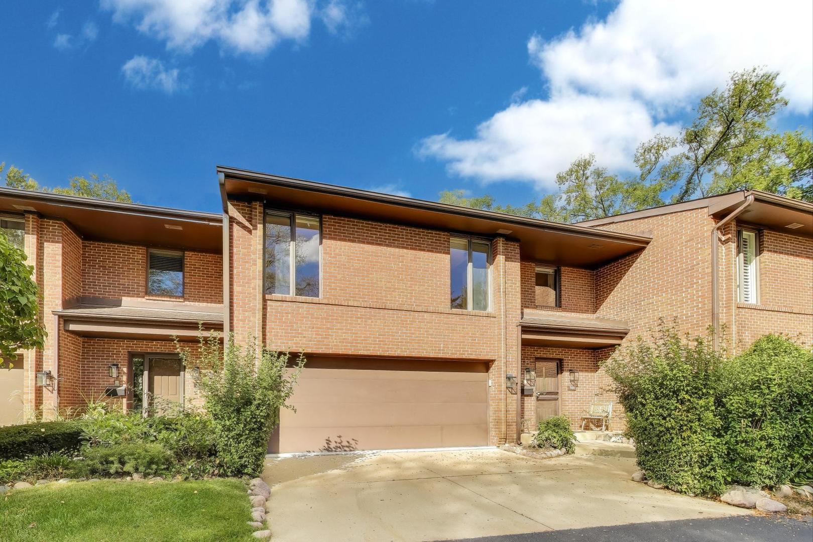 300 Boardwalk Place Park Ridge, IL 60068 - Photo 3 of 52 a front view of a house with a garden