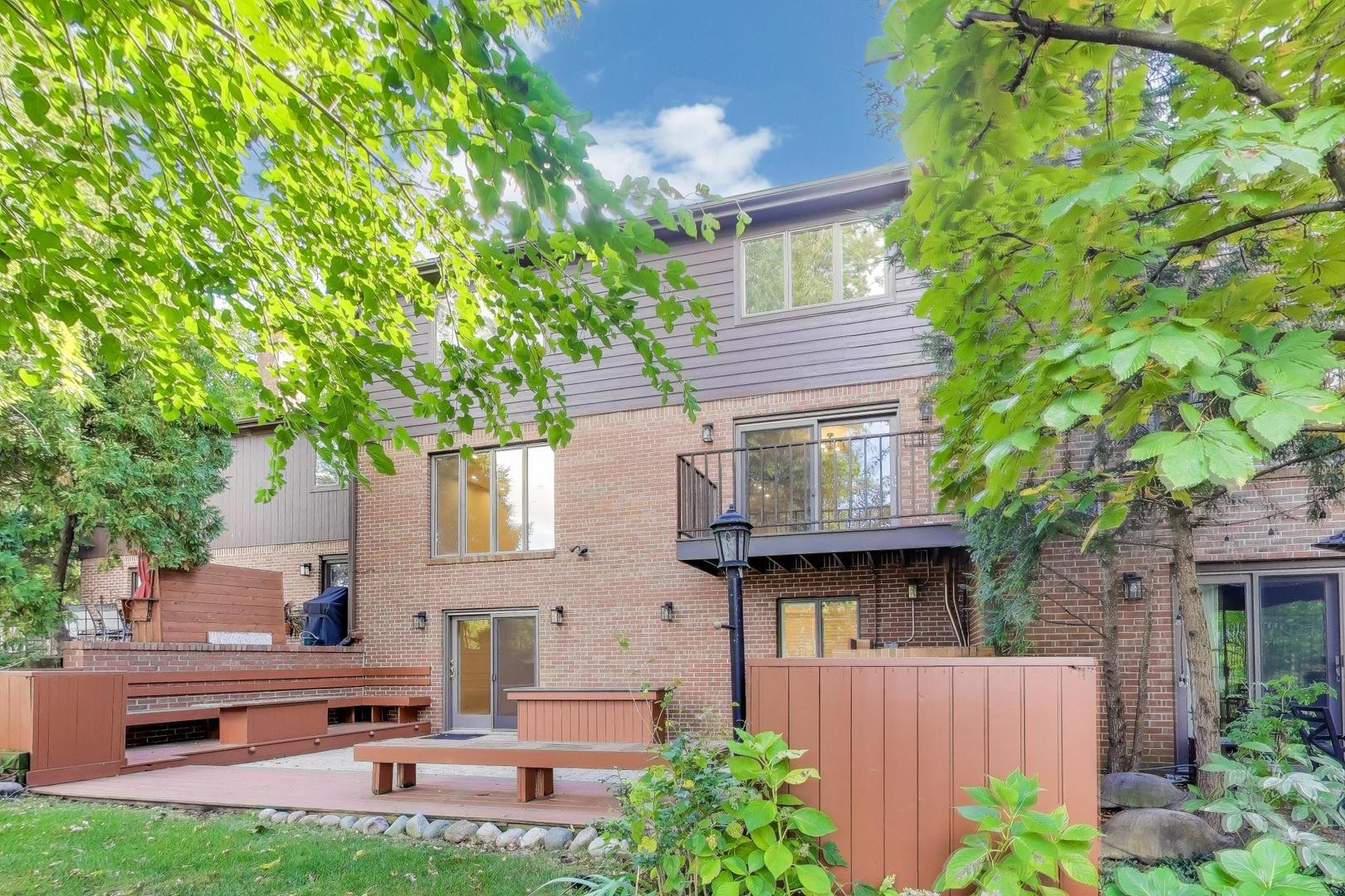 300 Boardwalk Place Park Ridge, IL 60068 - Photo 43 of 52 a front view of a house with garden