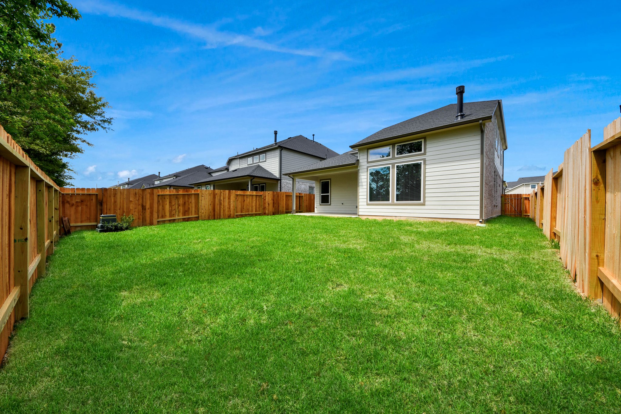 2946 Burris Park Drive Spring, TX 77373 - Photo 43 of 45 Backyard retreat, offering an abundance of space for kids to play and explore. The possibilities are endless in this outdoor haven, where the joy of open-air activities and family gatherings awaits.