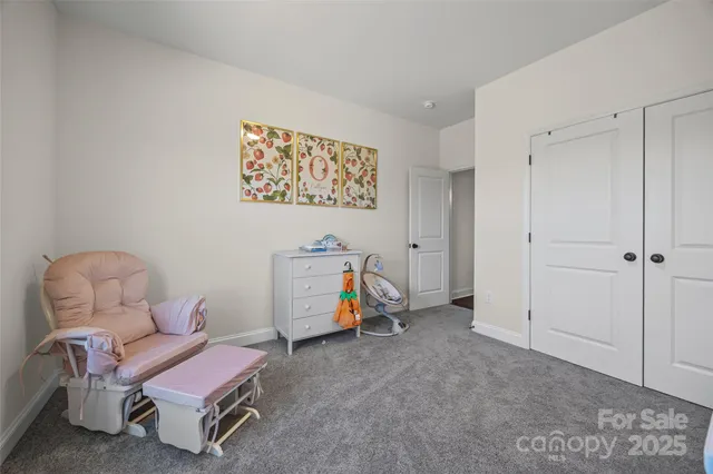 a view of a room with furniture and toys
