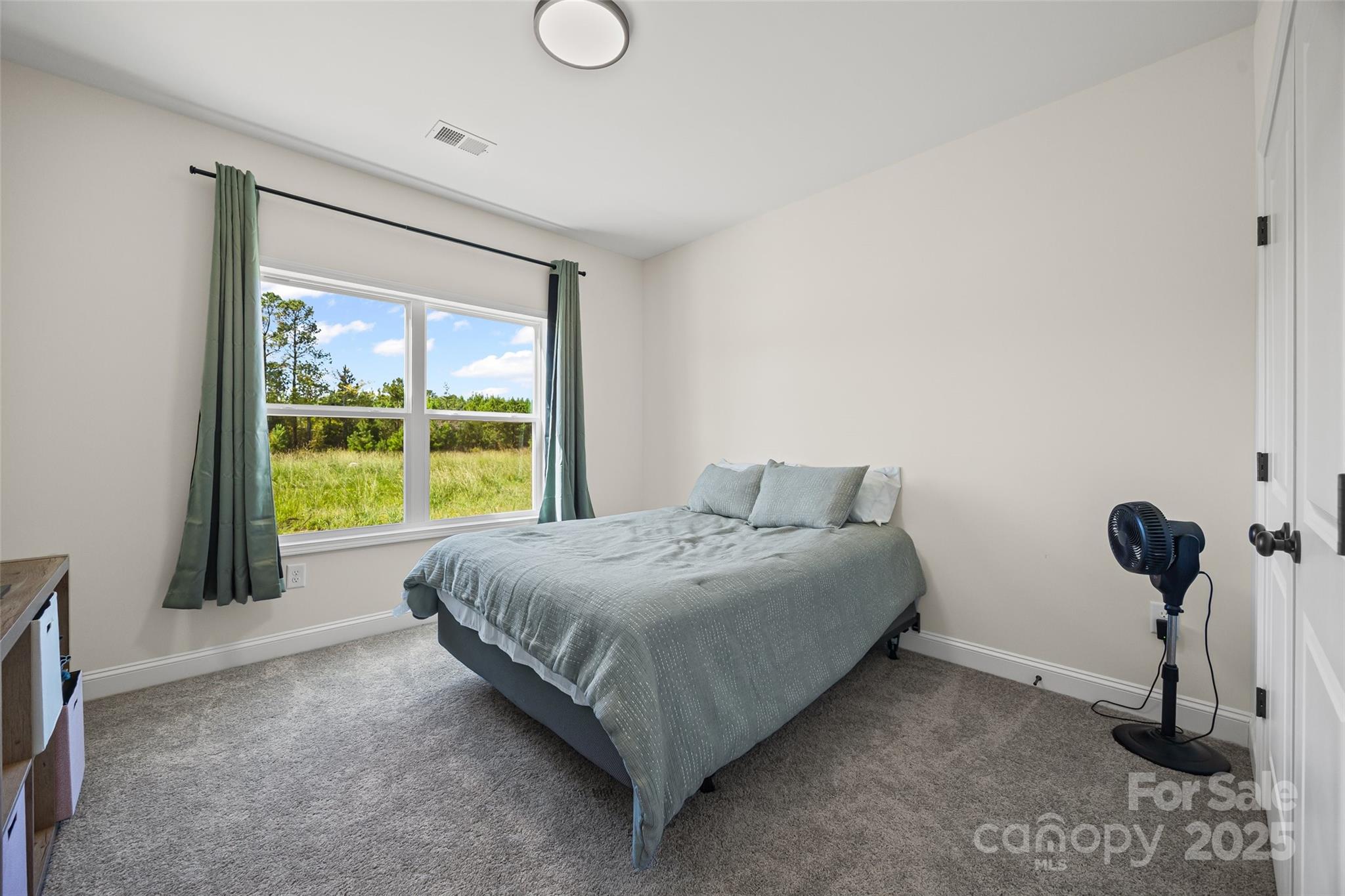 4822 Bull Run Road Blackstock, SC 29014 - Photo 16 of 34 a bedroom with a bed and a window