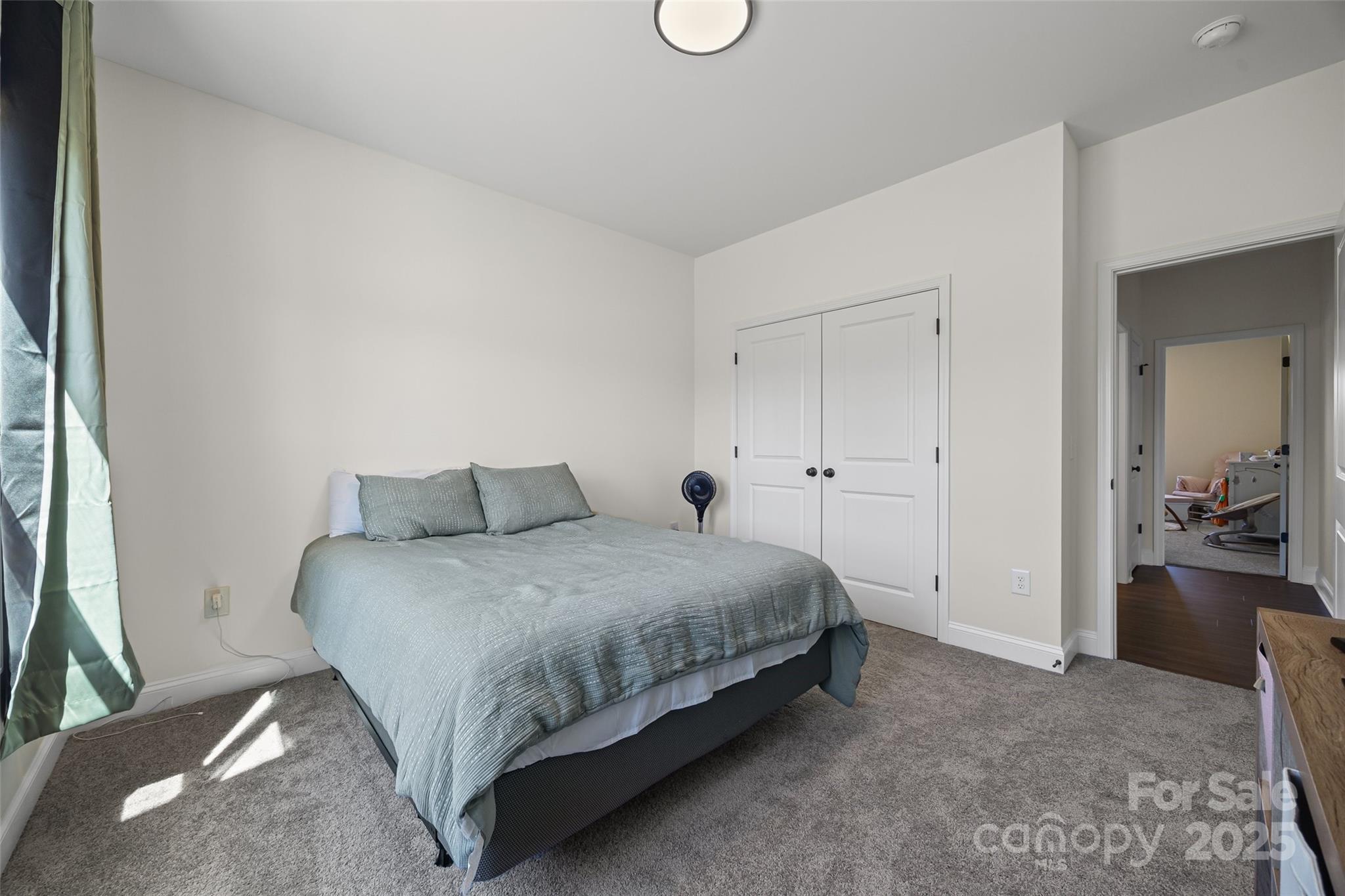 4822 Bull Run Road Blackstock, SC 29014 - Photo 17 of 34 a spacious bedroom with a bed and cabinets