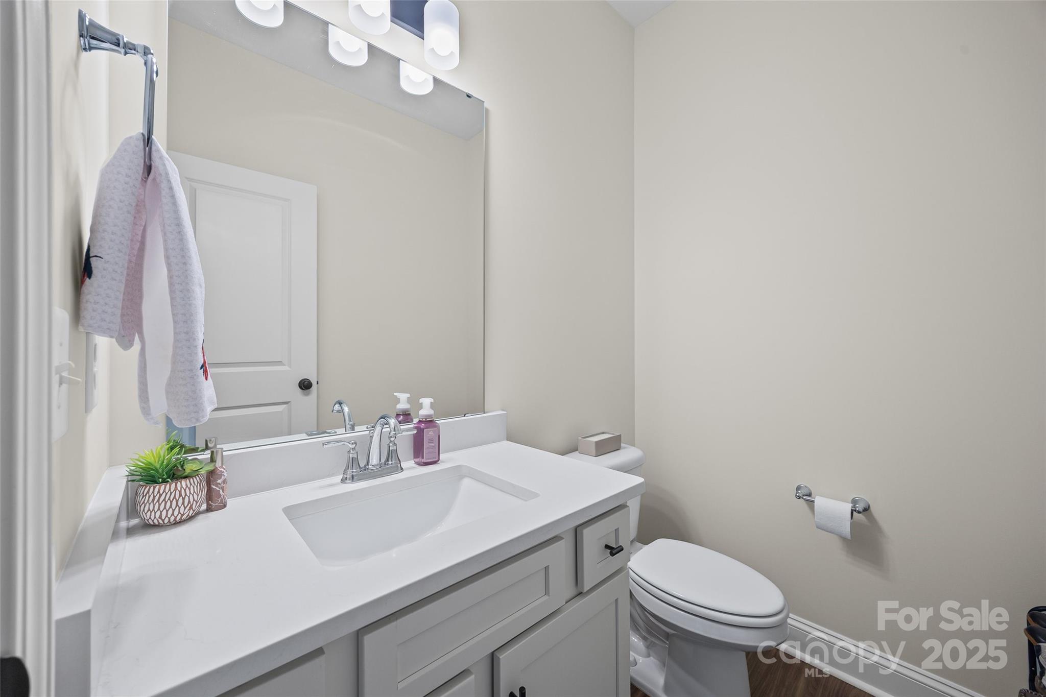 4822 Bull Run Road Blackstock, SC 29014 - Photo 18 of 34 a bathroom with a sink a toilet and a mirror