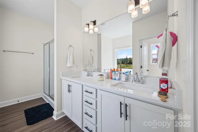 a bathroom with a sink vanity and a mirror