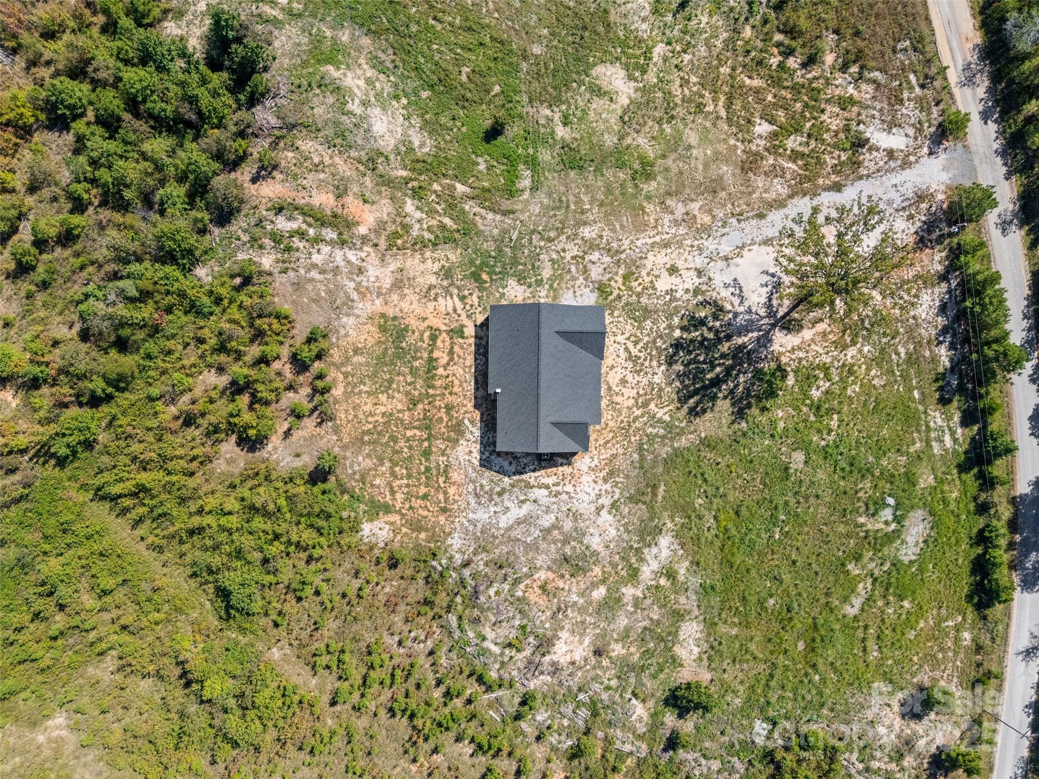 4822 Bull Run Road Blackstock, SC 29014 - Photo 29 of 34 a backyard of a house with a tree