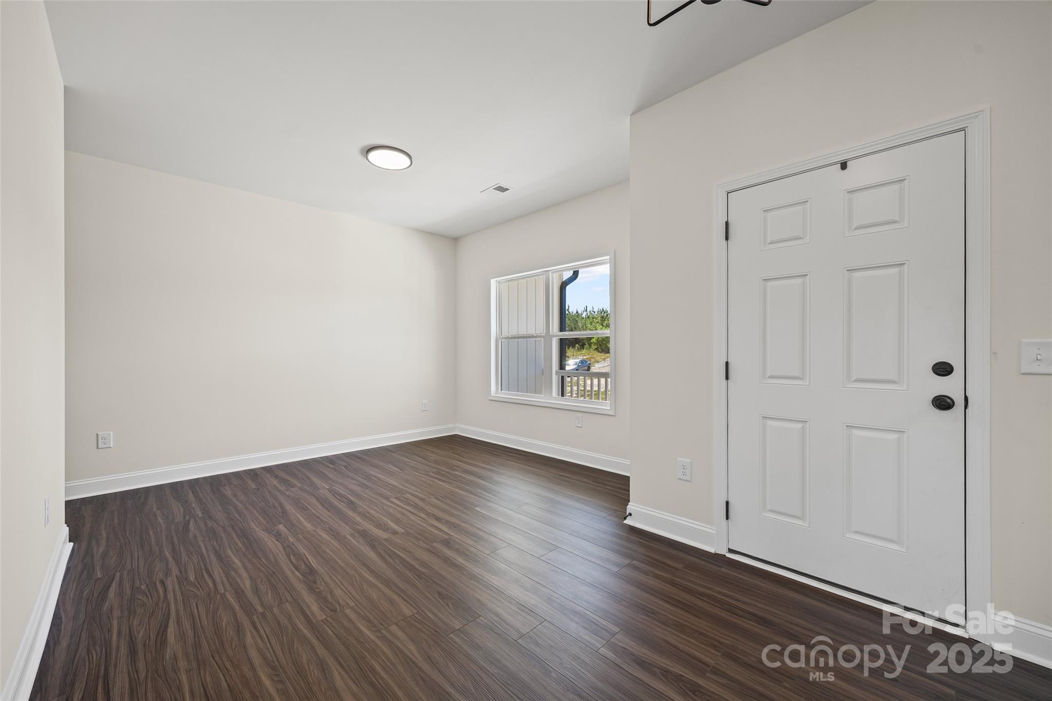 4822 Bull Run Road Blackstock, SC 29014 - Photo 3 of 34 a view of an empty room with wooden floor and a window