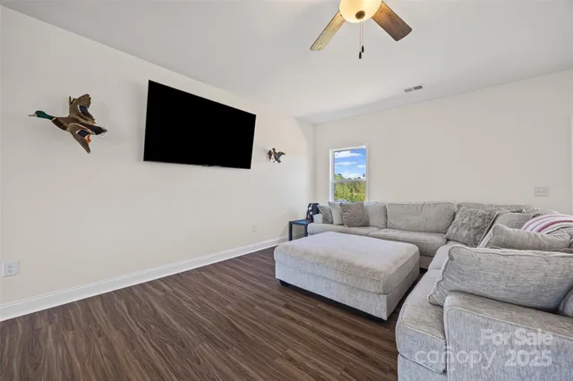 a living room with a couch and a flat screen tv