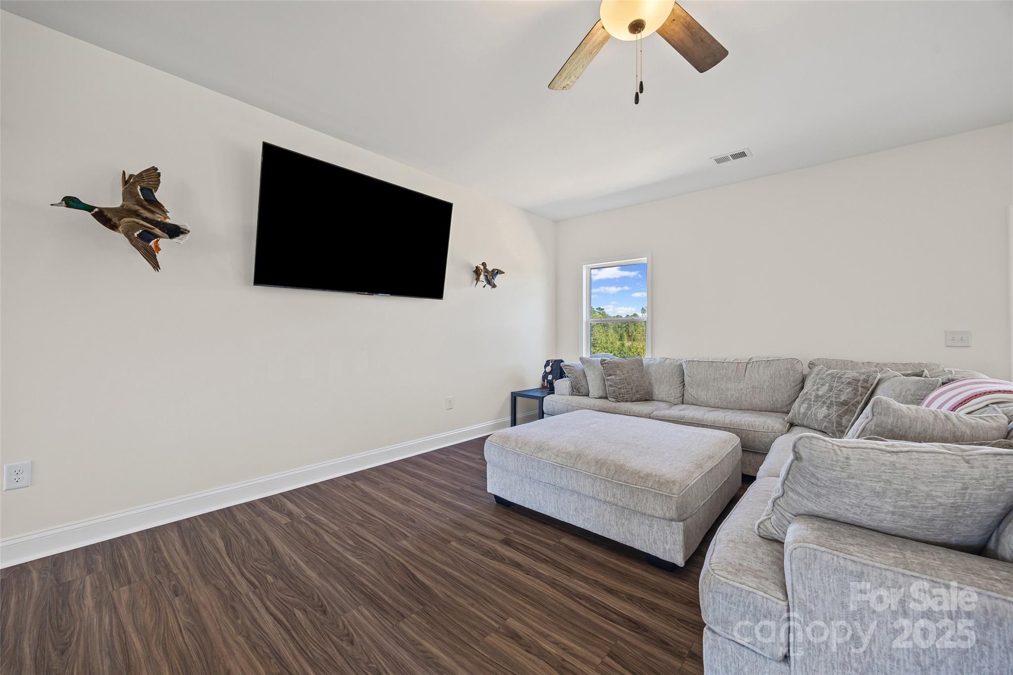 4822 Bull Run Road Blackstock, SC 29014 - Photo 6 of 34 a living room with a couch and a flat screen tv