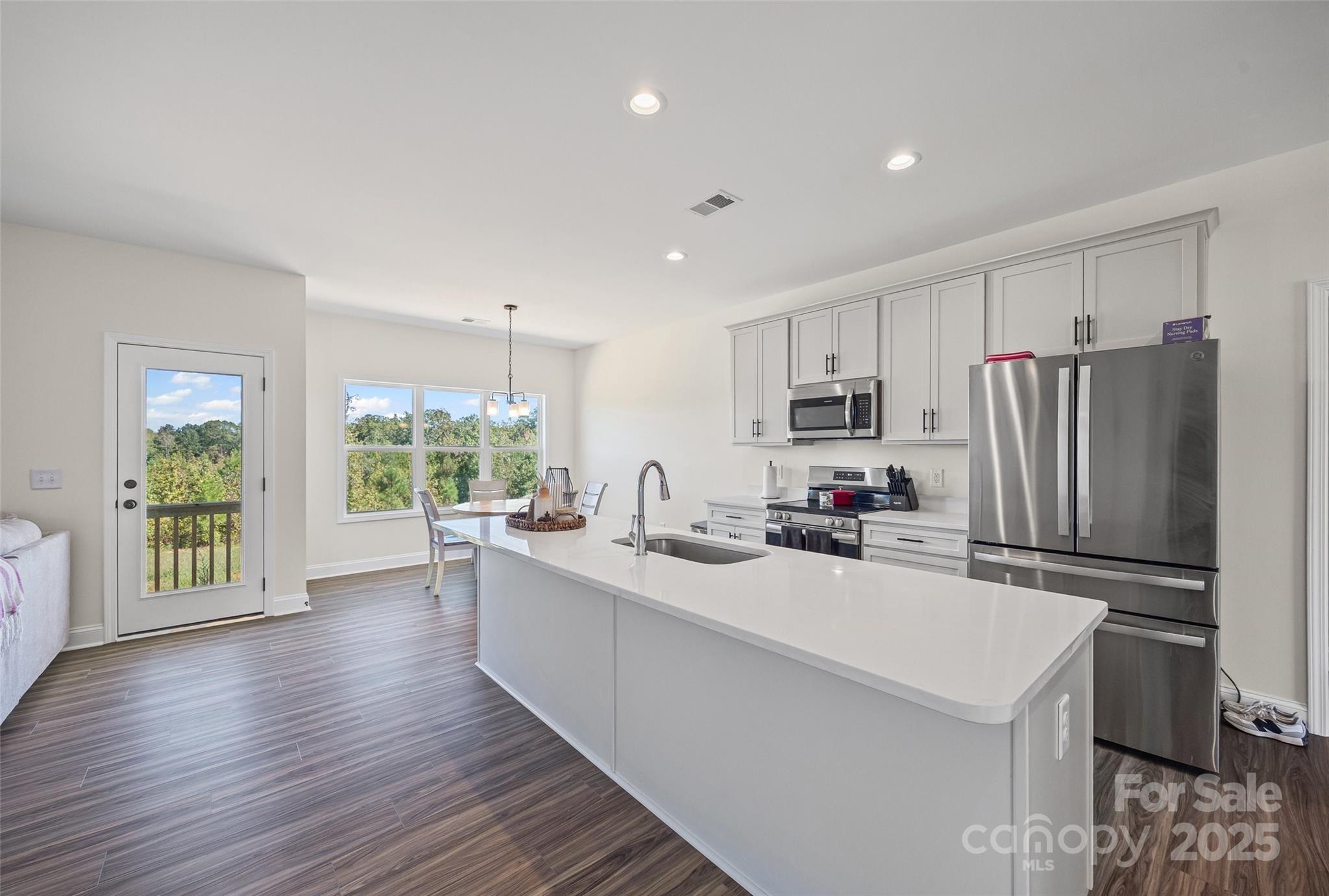 4822 Bull Run Road Blackstock, SC 29014 - Photo 9 of 34 a kitchen with a sink stainless steel appliances a refrigerator and a stove