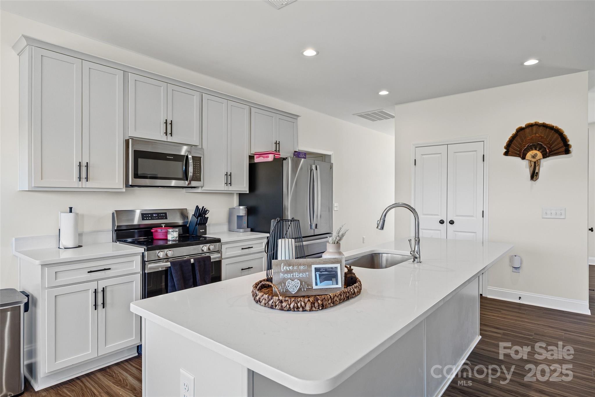 4822 Bull Run Road Blackstock, SC 29014 - Photo 10 of 34 a kitchen with stainless steel appliances kitchen island granite countertop a sink a stove and refrigerator